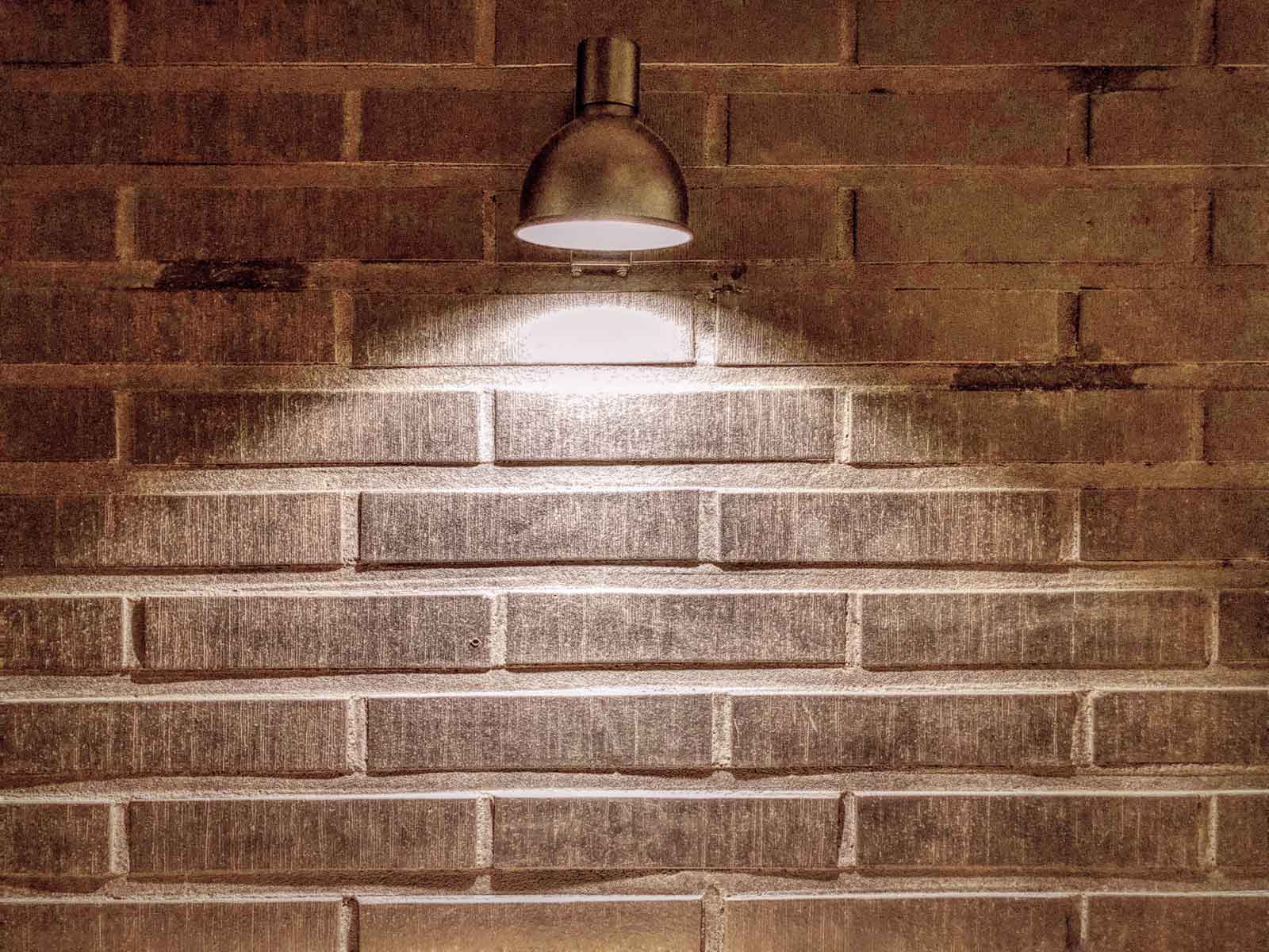 lamplight-wall-background-with-space-1600w Image of a pool, featured by Electrician Flowermound, highlighting pool services offered in the context of electrical work related to pool installations and maintenance.
